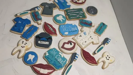 Dental-themed cookies including scrubs, teeth, toothbrushes and tools